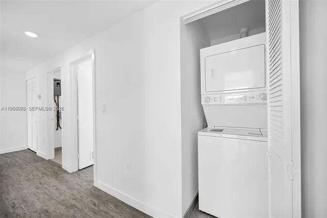 a view of storage and utility room with washer and dryer
