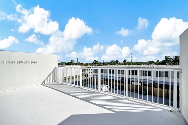 a view of a swimming pool with a patio and a yard