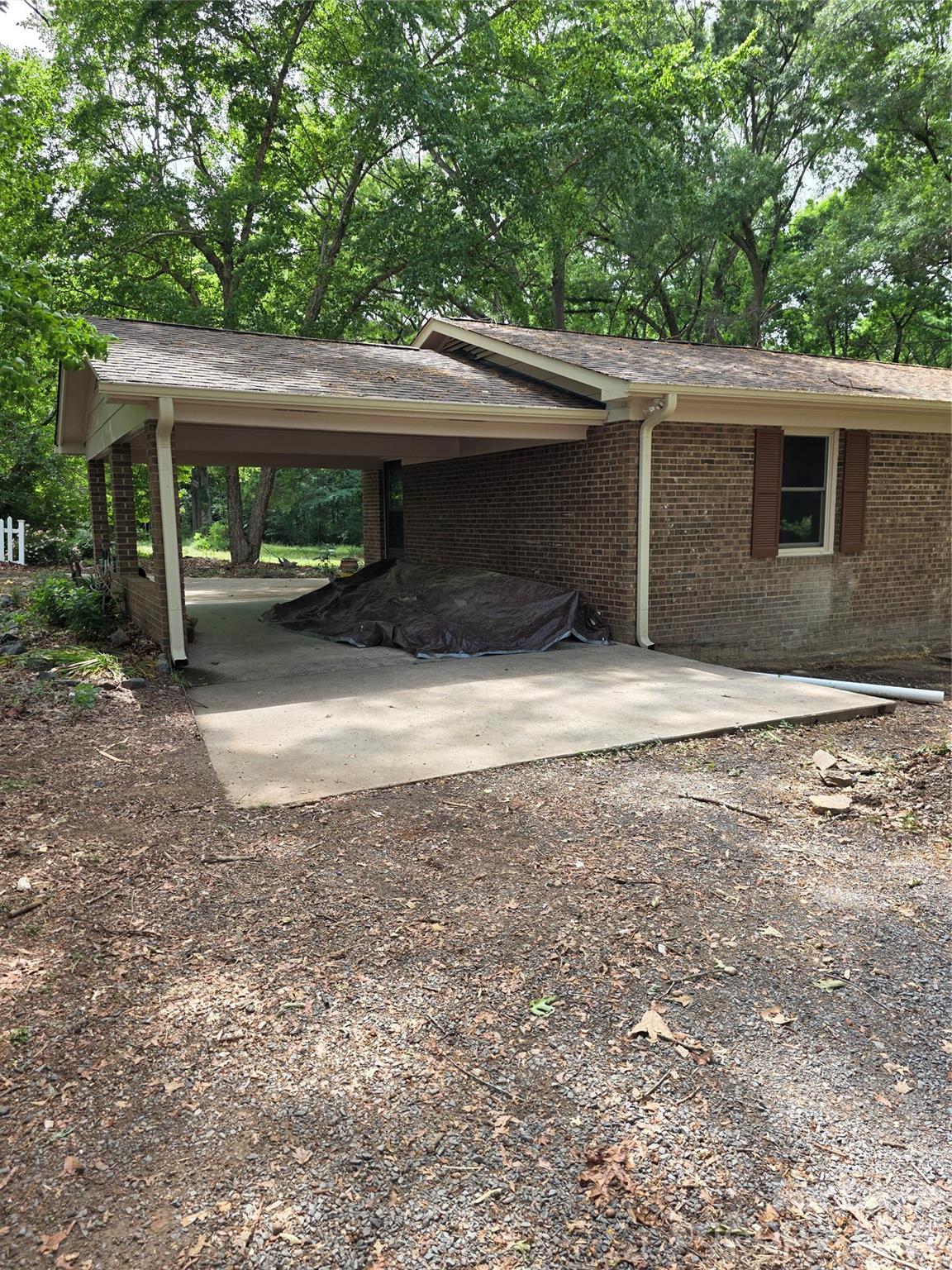 5710 Unionville Road Monroe, NC 28110 - Photo 3 of 18 a backyard of a house with yard and garage