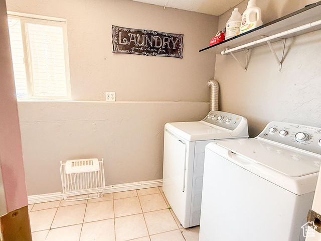 425 East Mule Deer Road Central, UT 84722 - Photo 39 of 72 Washroom with washing machine and dryer, light tile patterned floors, and heating unit