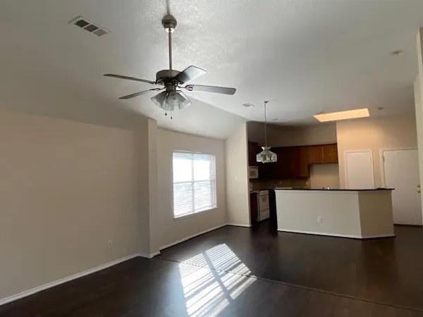 a view of a kitchen with a sink and a window