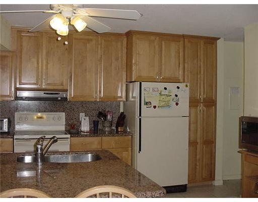 5761 Southwest 185th Way Southwest Ranches, FL 33332 - Photo 4 of 7 a kitchen with refrigerator and cabinets