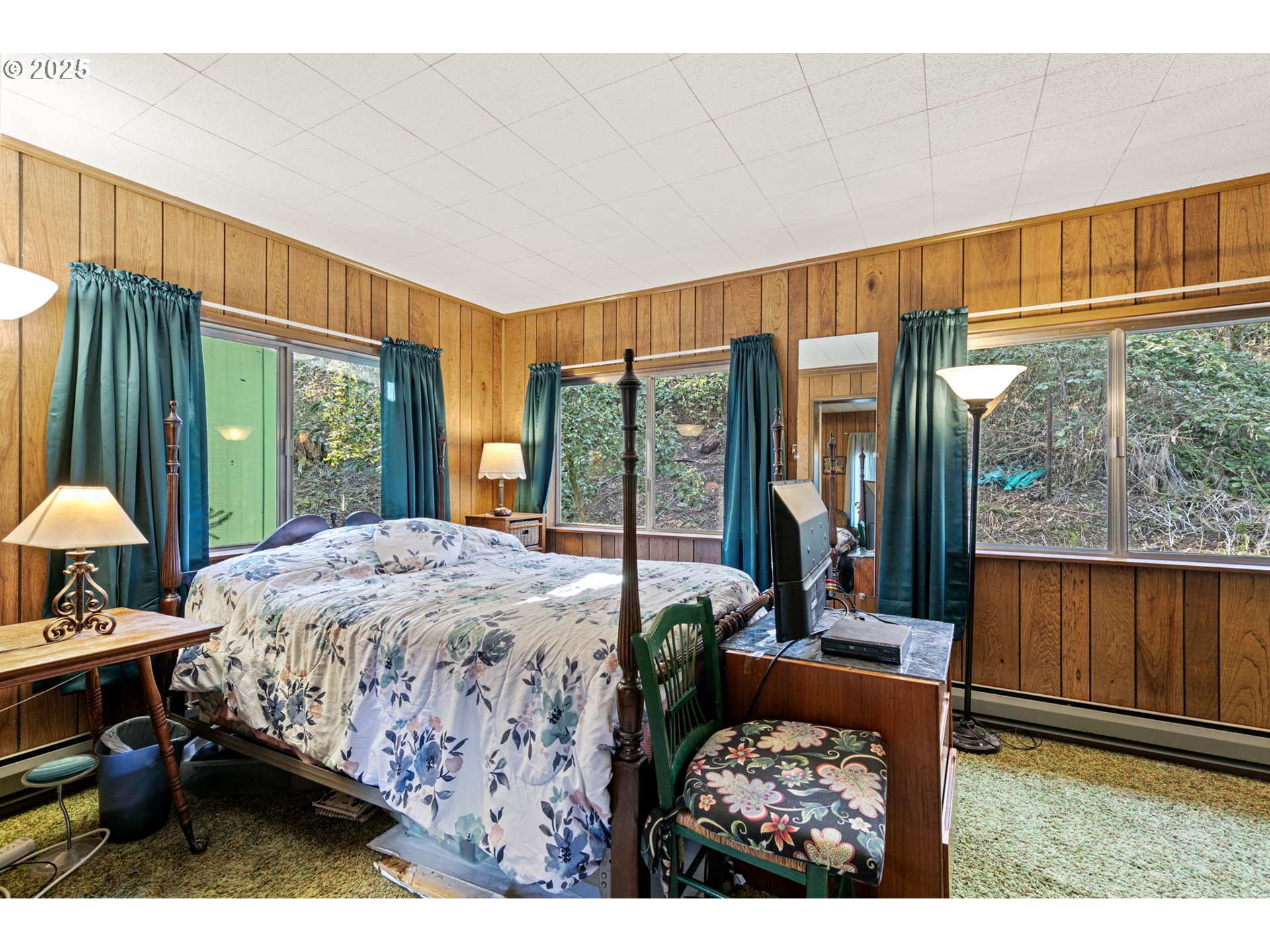 44531 McKenzie Highway Leaburg, OR 97489 - Photo 18 of 48 a bed sitting in a bedroom next to a window