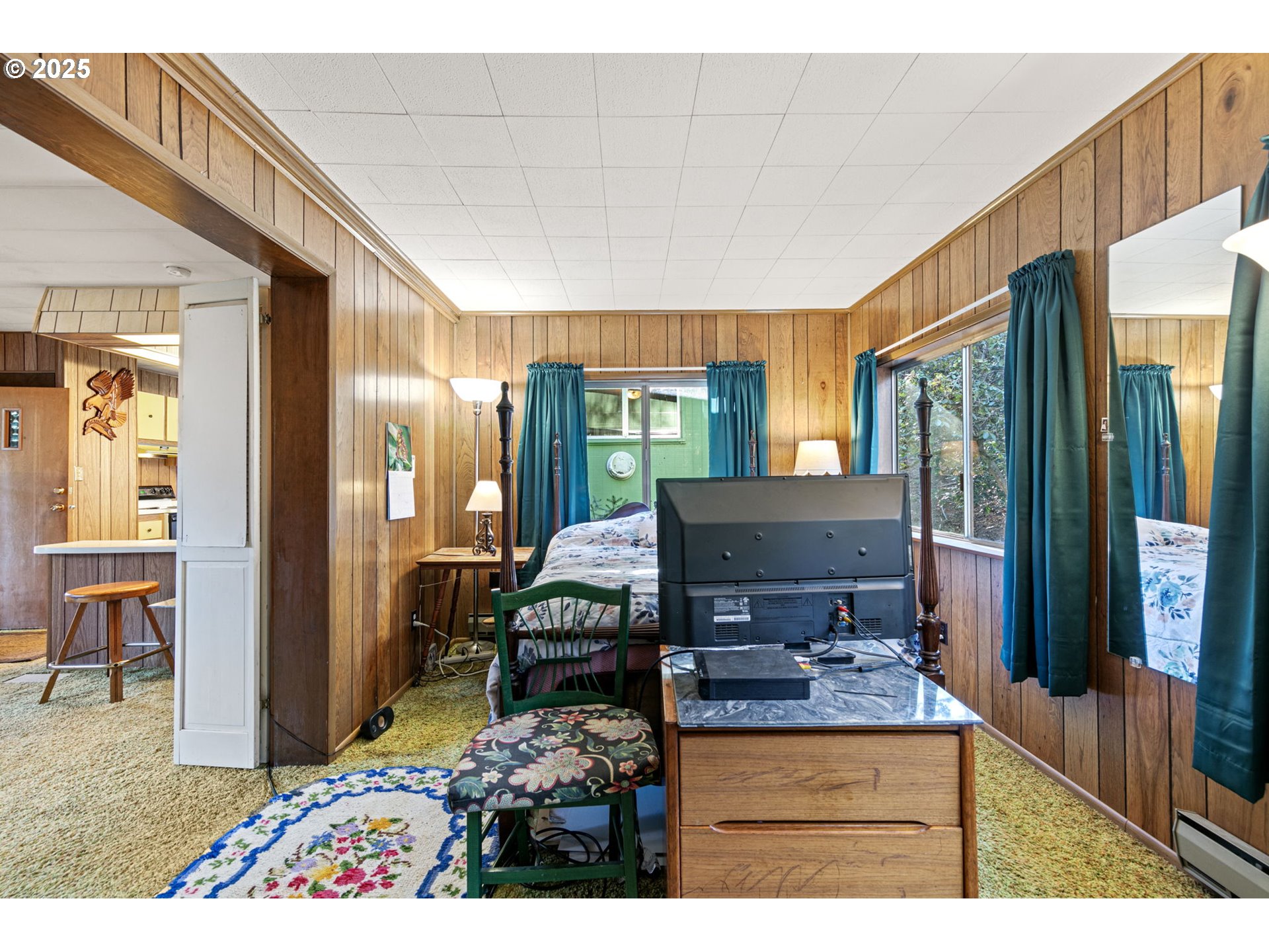 44531 McKenzie Highway Leaburg, OR 97489 - Photo 19 of 48 a living room with furniture and a flat screen tv