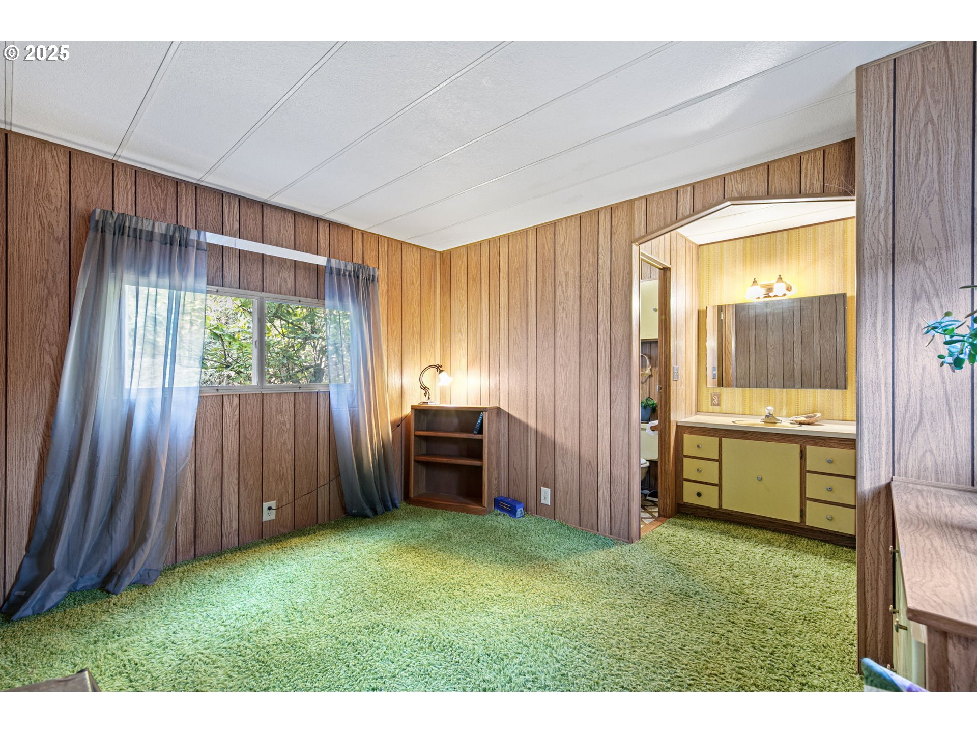 44531 McKenzie Highway Leaburg, OR 97489 - Photo 20 of 48 a bathroom with a sink and a large mirror