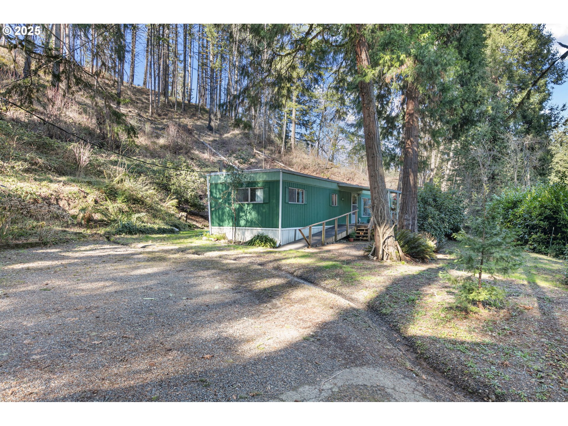 44531 McKenzie Highway Leaburg, OR 97489 - Photo 2 of 48 a view of backyard of a house
