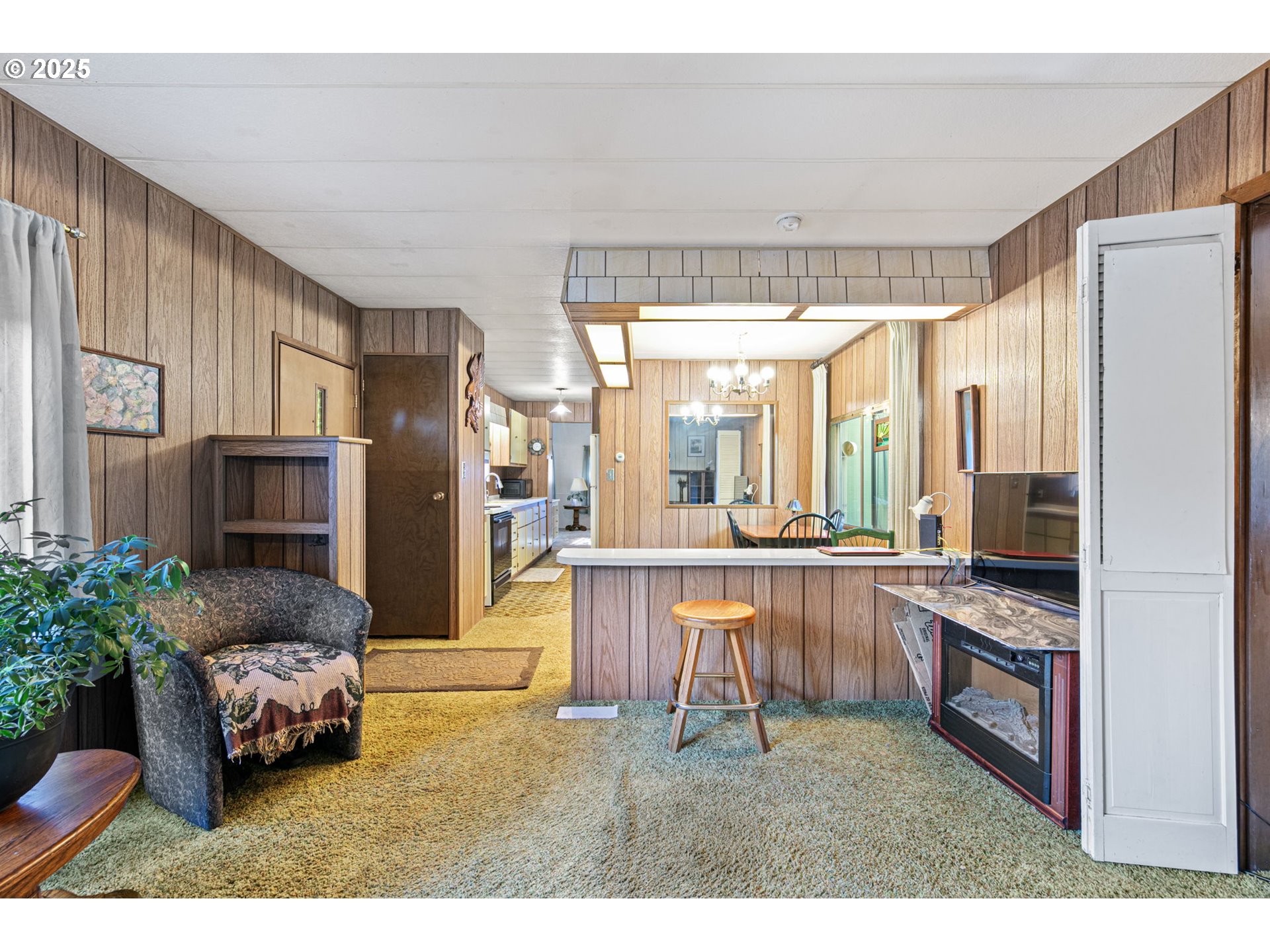 44531 McKenzie Highway Leaburg, OR 97489 - Photo 7 of 48 a living room with stainless steel appliances kitchen island granite countertop furniture and a fireplace