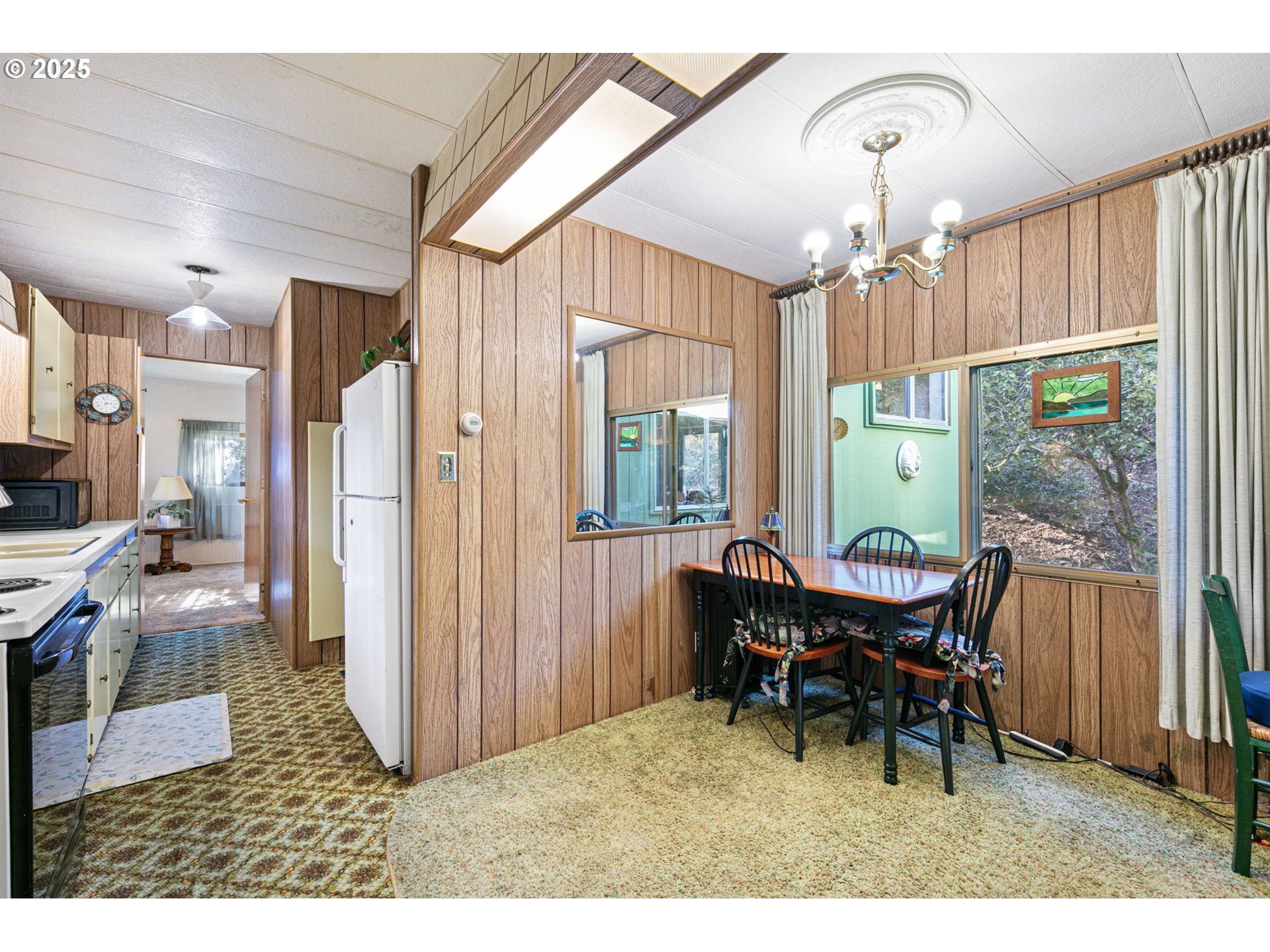 44531 McKenzie Highway Leaburg, OR 97489 - Photo 8 of 48 a view of a dining room with furniture window and wooden floor