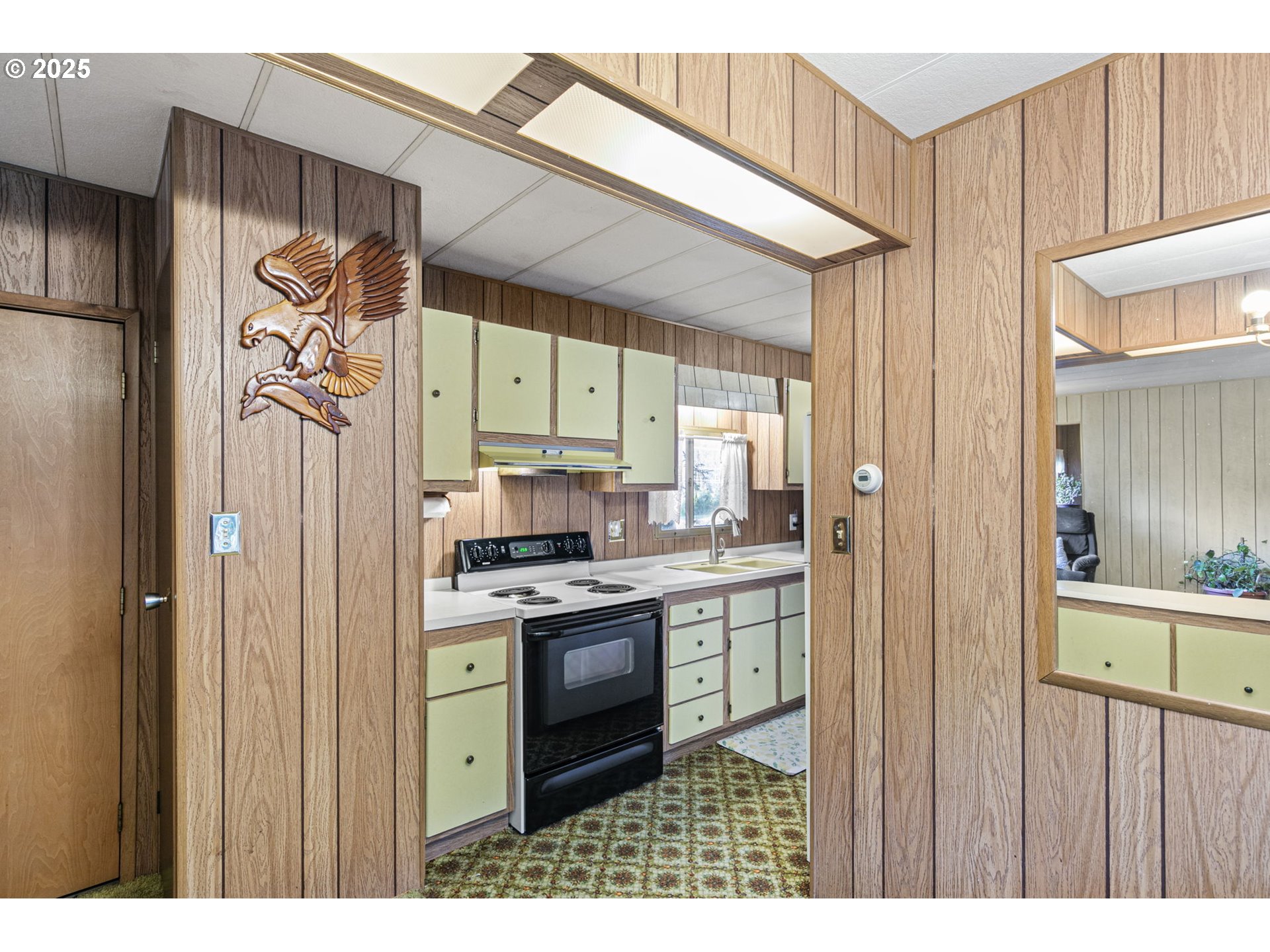 44531 McKenzie Highway Leaburg, OR 97489 - Photo 9 of 48 a kitchen with stainless steel appliances granite countertop a refrigerator a sink and white cabinets