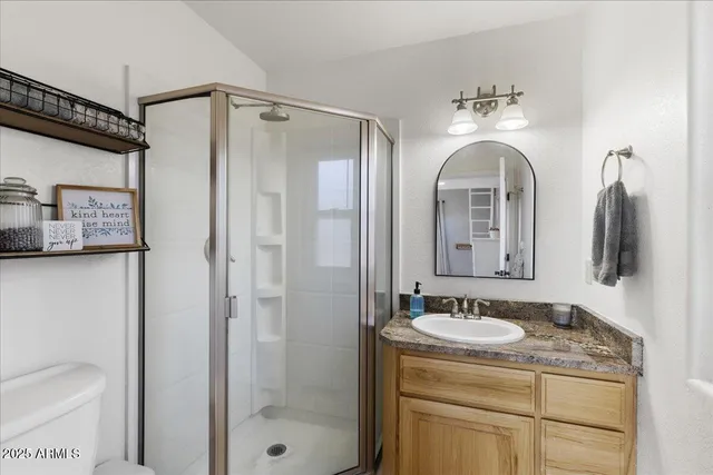 a view of a balcony with chairs and wooden floor