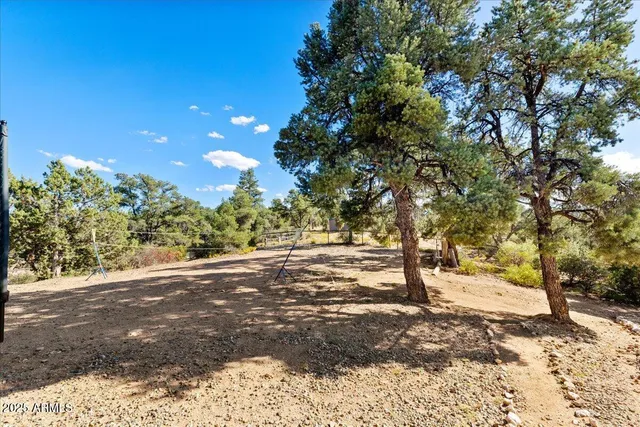 a view of a street with trees in the background