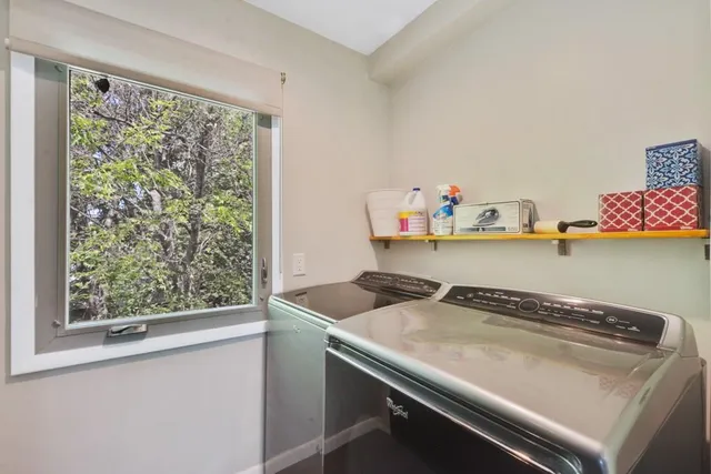 a utility room with washer and dryer