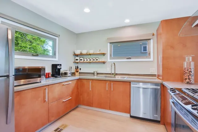 a kitchen with wooden cabinets and a sink