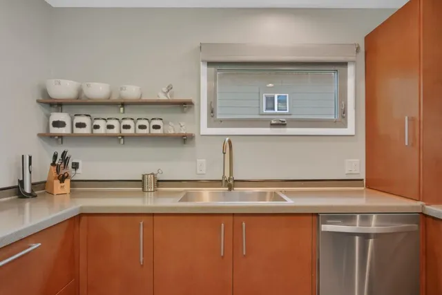 a kitchen with a sink and cabinets