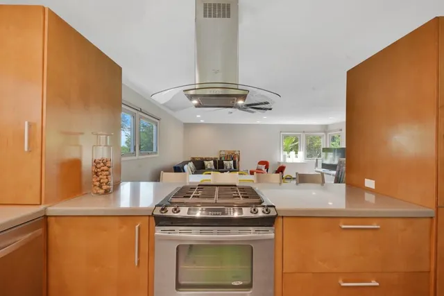 a kitchen with a stove and a refrigerator