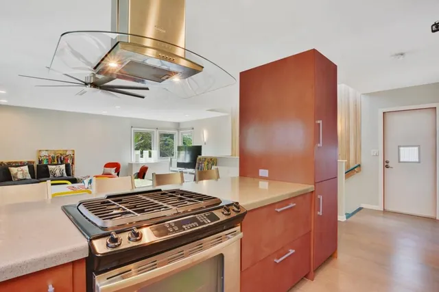 a kitchen with a stove and a refrigerator