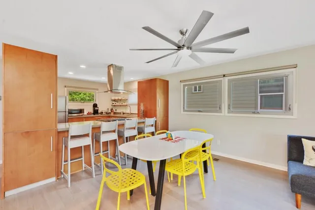 a dining room with furniture and window