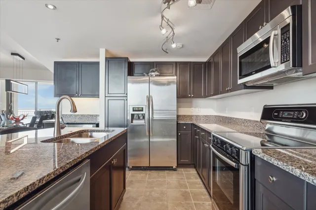 a bedroom with a large bed and a balcony