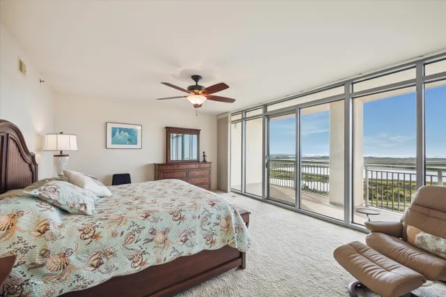 a en suite bathroom with a granite countertop sink and a mirror