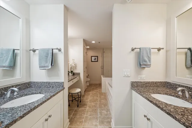 a bed room with a bed and a chair