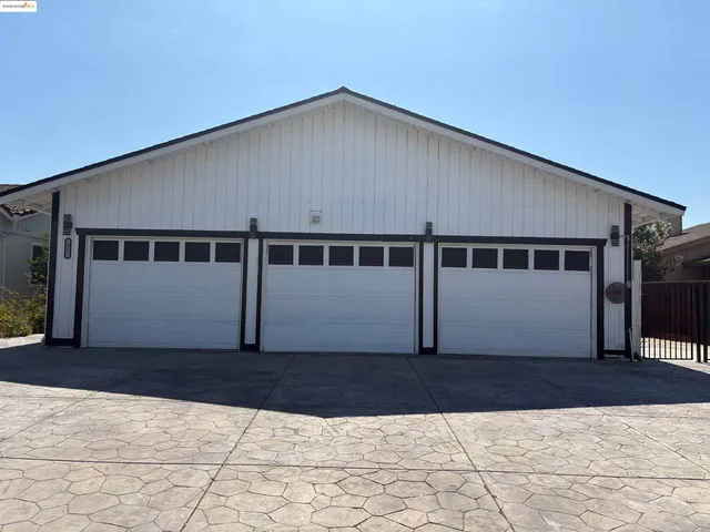 a house with wooden fence