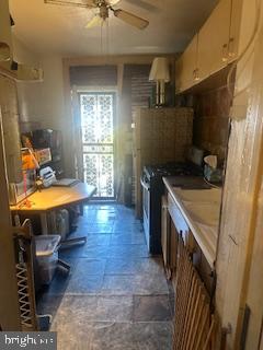 3316 Cardenas Avenue Baltimore, MD 21213 - Photo 4 of 8 a kitchen with a sink appliances and cabinets
