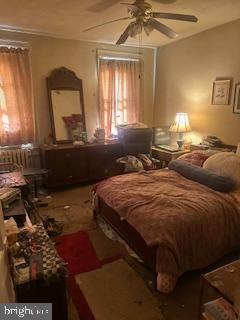 3316 Cardenas Avenue Baltimore, MD 21213 - Photo 7 of 8 a bedroom with a bed and a window