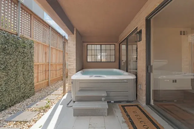 a bathroom with a tub and shower