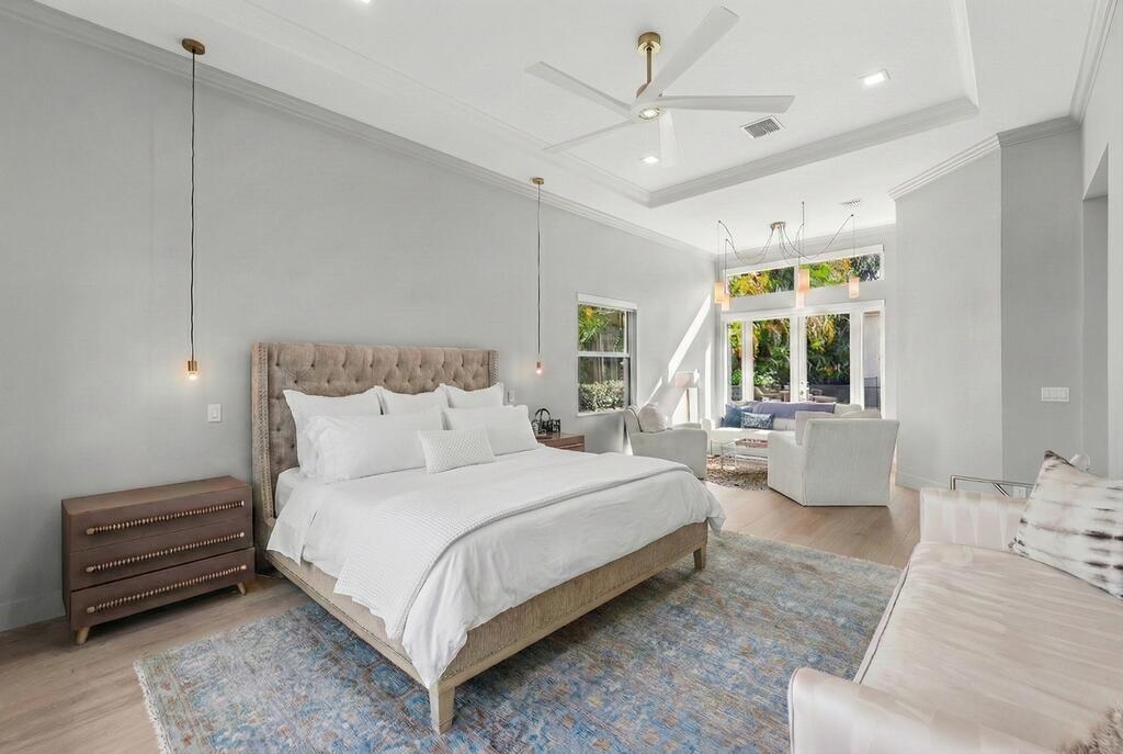 8849 Valhalla Drive Delray Beach, FL 33446 - Photo 20 of 51 a bedroom with a large bed couch and windows