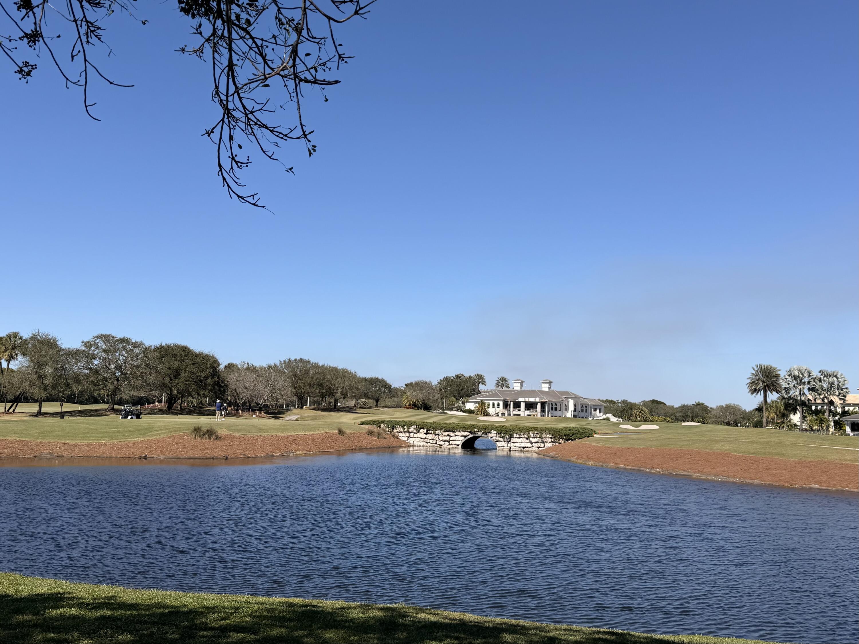 8849 Valhalla Drive Delray Beach, FL 33446 - Photo 29 of 51 a view of a lake with houses in the background