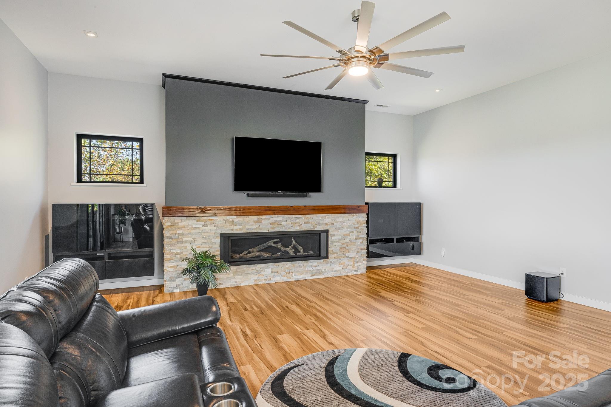 1387 Woods Ammons Road Mars Hill, NC 28754 - Photo 19 of 48 a living room with furniture and a flat screen tv