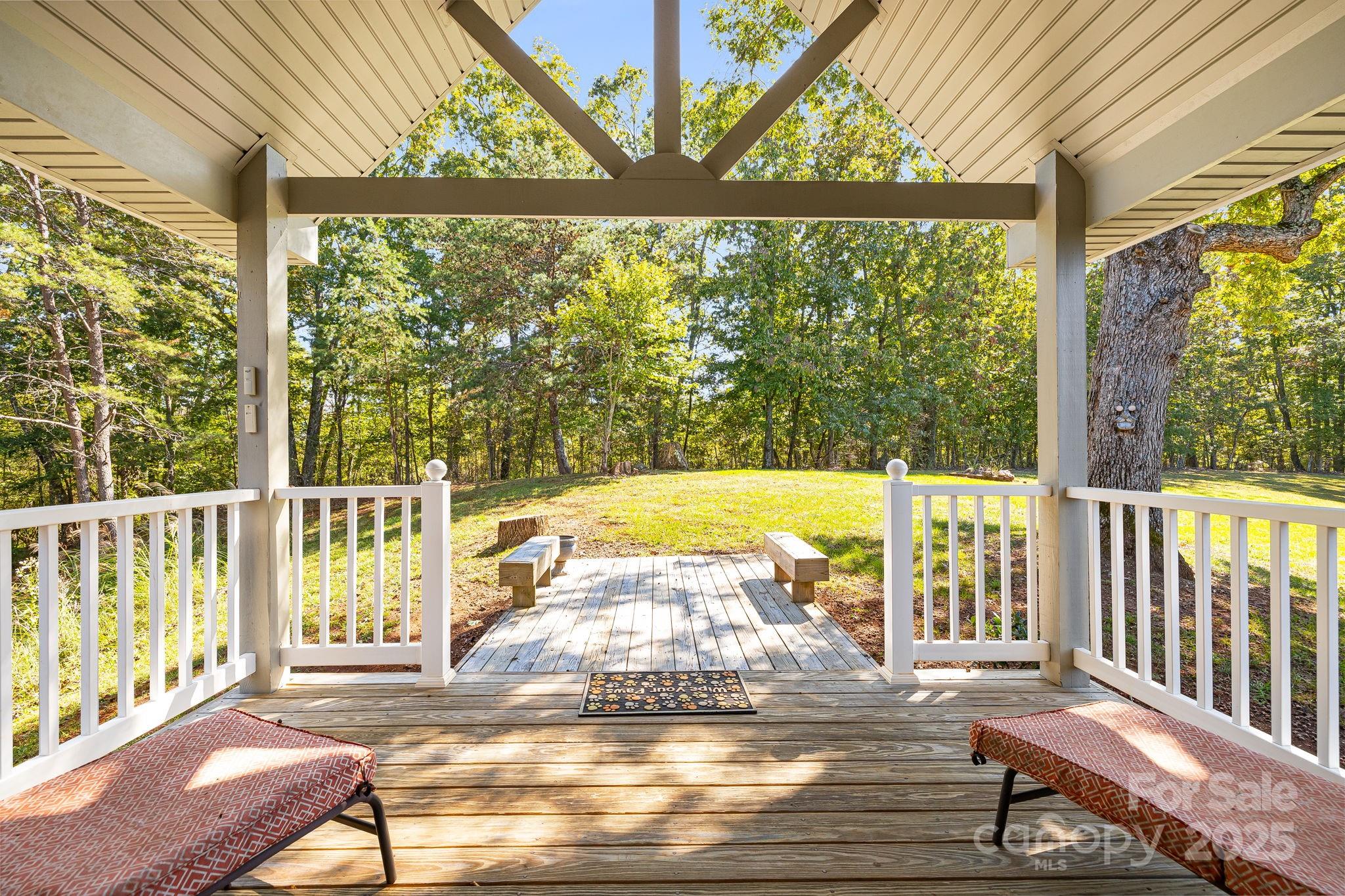 1387 Woods Ammons Road Mars Hill, NC 28754 - Photo 25 of 48 a view of a swimming pool with a lounge chairs