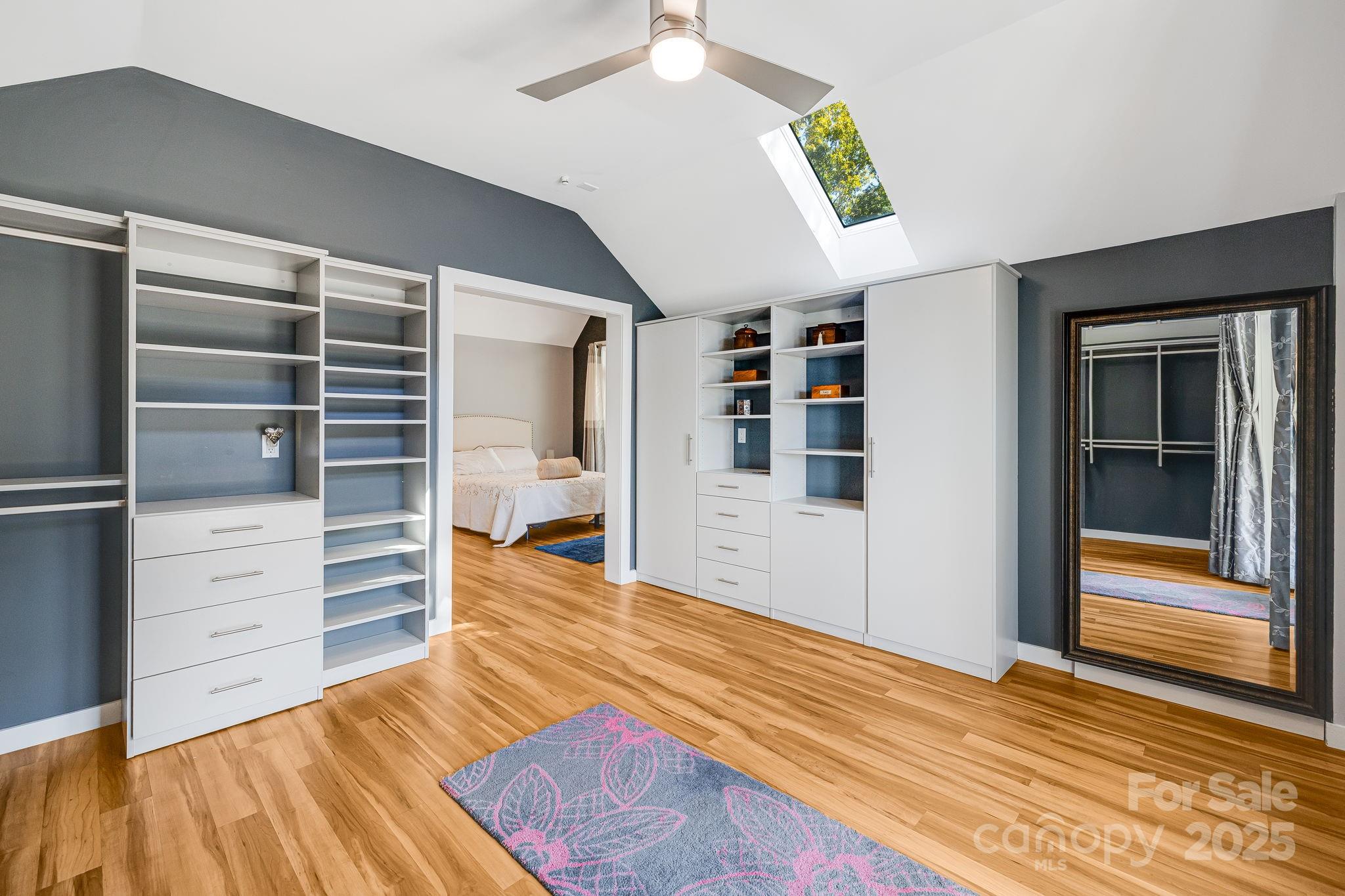 1387 Woods Ammons Road Mars Hill, NC 28754 - Photo 26 of 48 a view of a bedroom with closet and cabinet