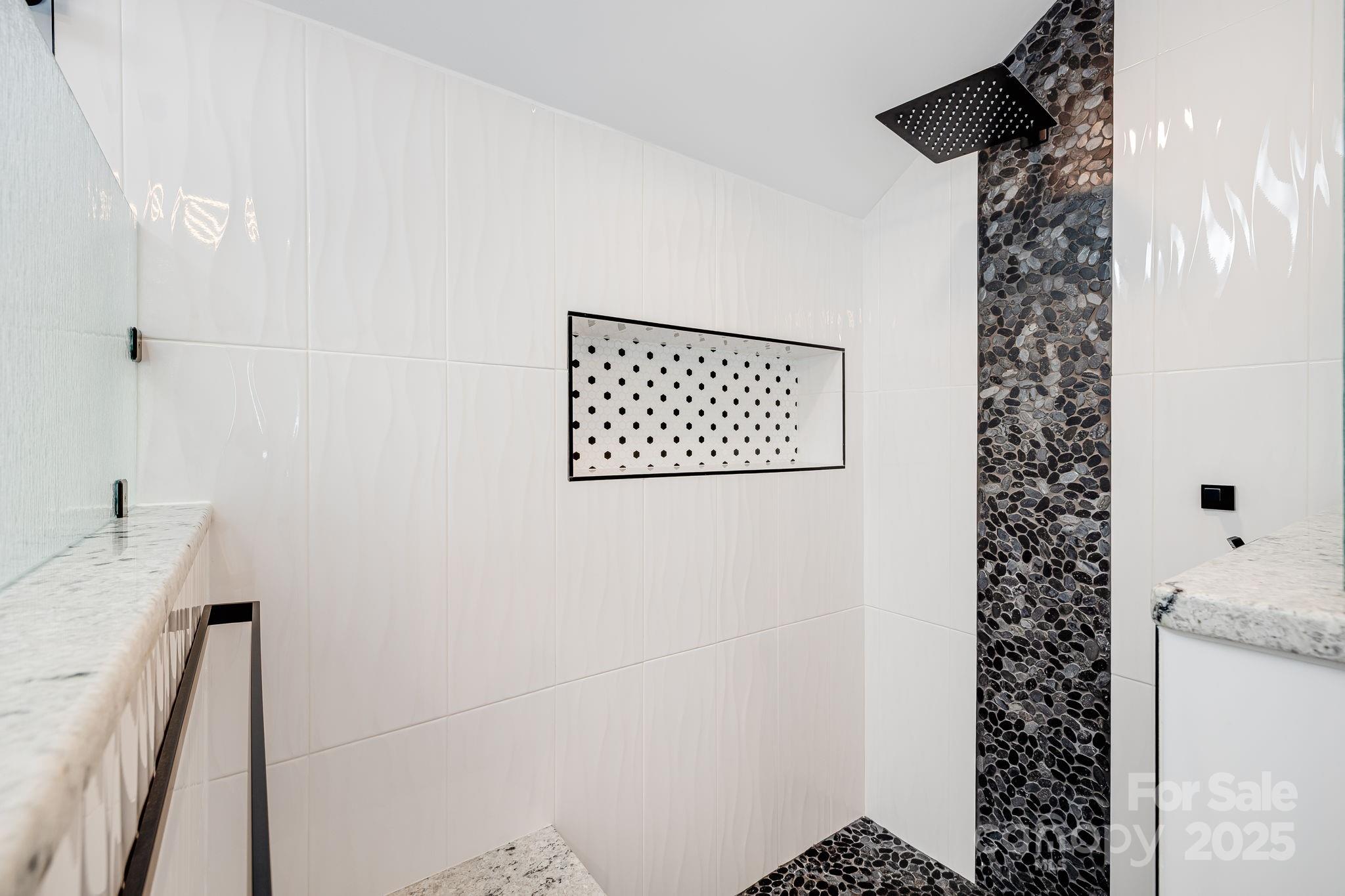 1387 Woods Ammons Road Mars Hill, NC 28754 - Photo 30 of 48 a bathroom with a shower and a sink