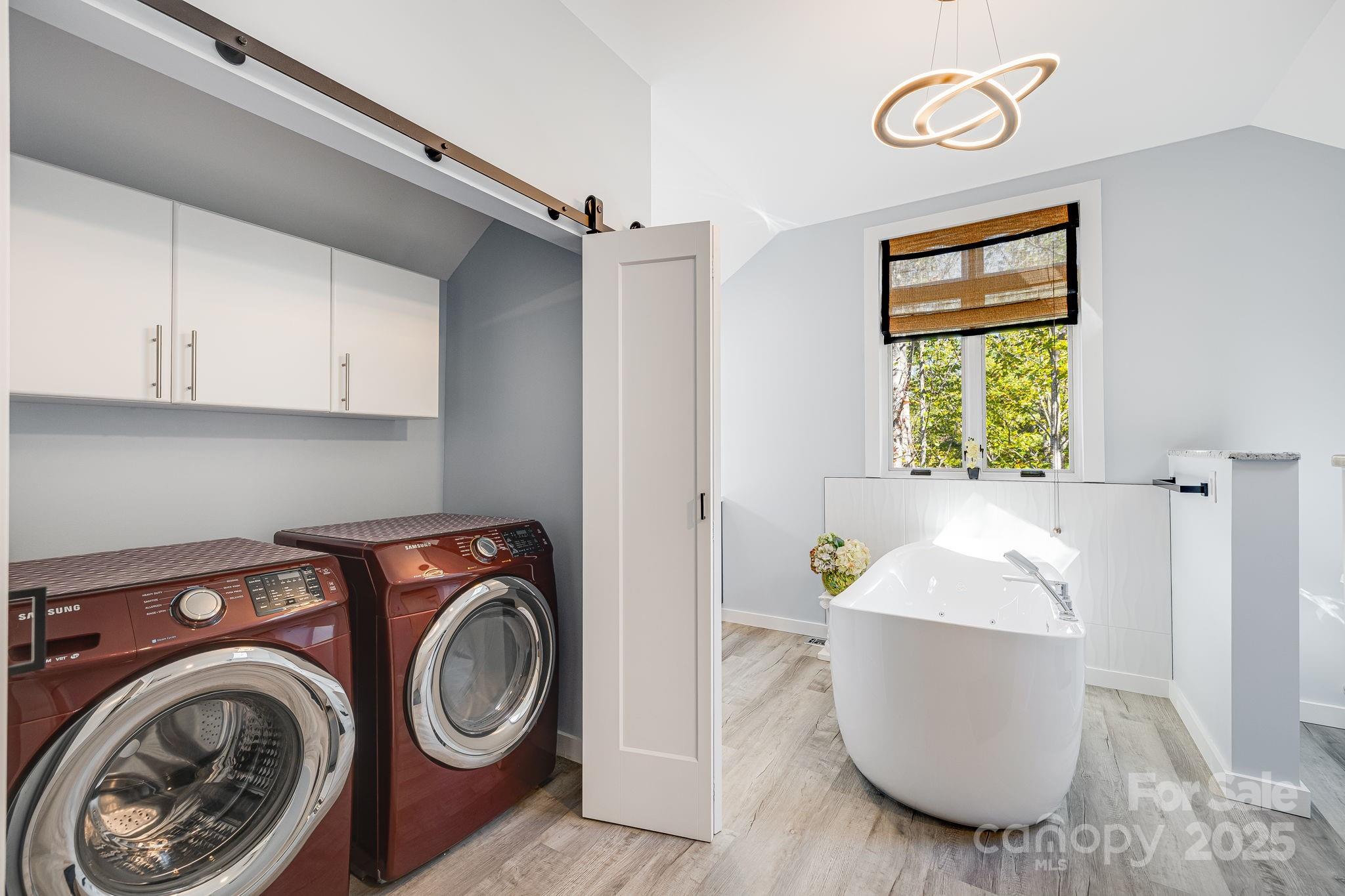 1387 Woods Ammons Road Mars Hill, NC 28754 - Photo 31 of 48 a view of a kitchen with a sink washer and dryer