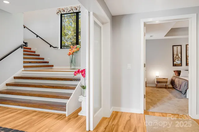 a kitchen with a stove a sink and a clock