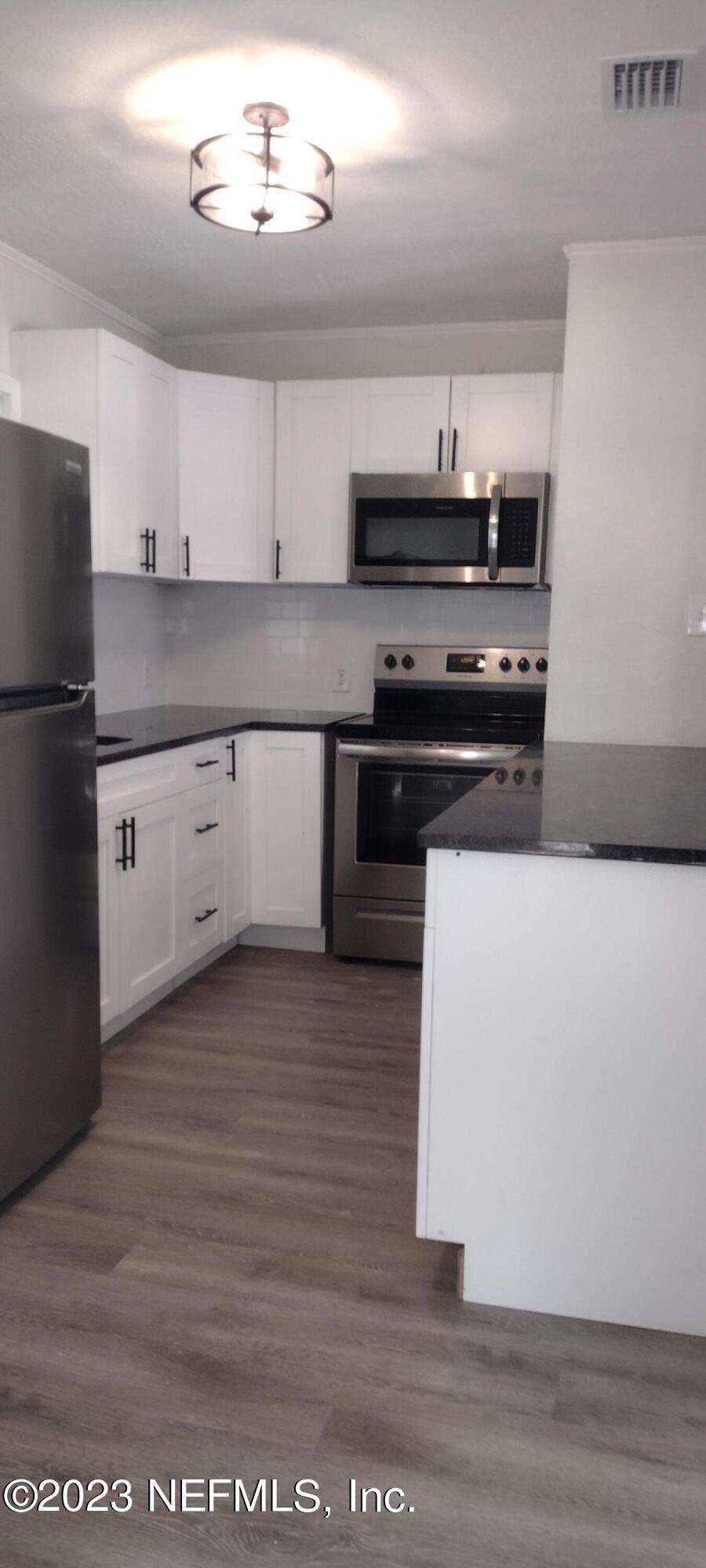8916 Ricardo Lane Jacksonville, FL 32216 - Photo 21 of 33 Kitchen Long Side View