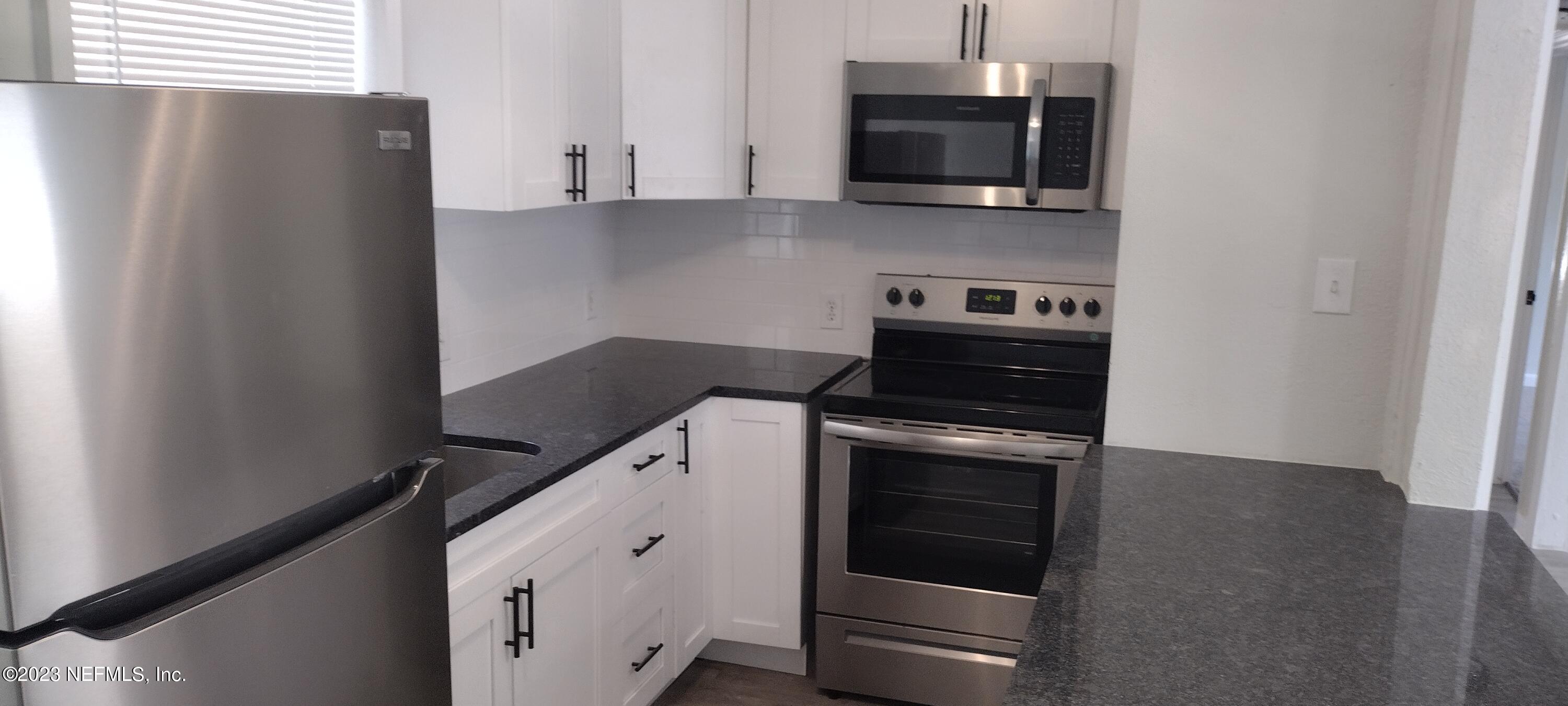 8916 Ricardo Lane Jacksonville, FL 32216 - Photo 27 of 33 Kitchen Side View