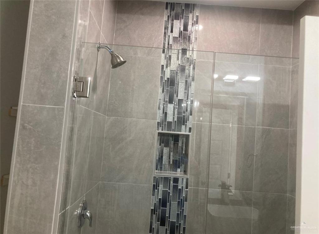1411 South Flag Street, Unit 1 Pharr, TX 78577 - Photo 12 of 12 a bathroom with a glass shower door