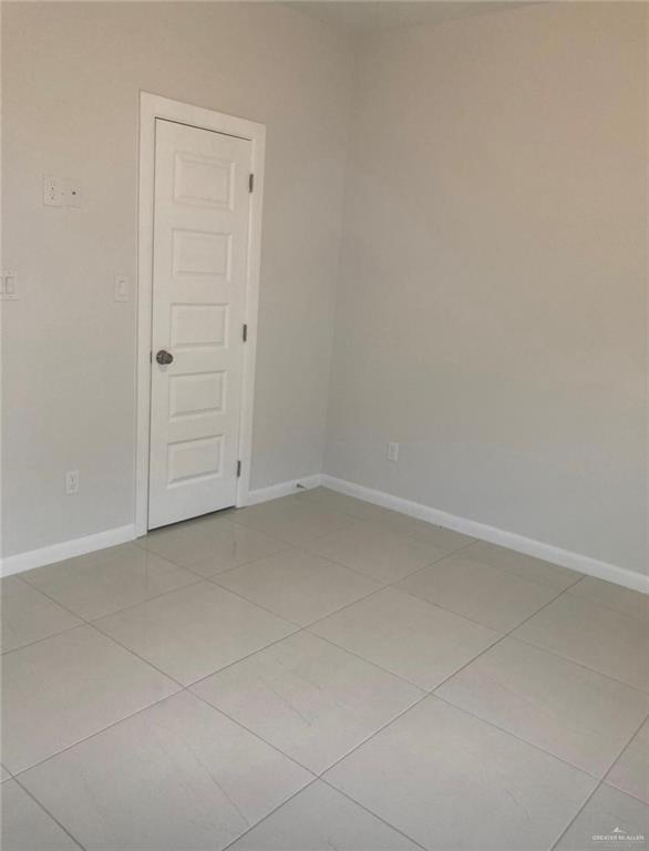1411 South Flag Street, Unit 1 Pharr, TX 78577 - Photo 3 of 12 an empty room with an entryway