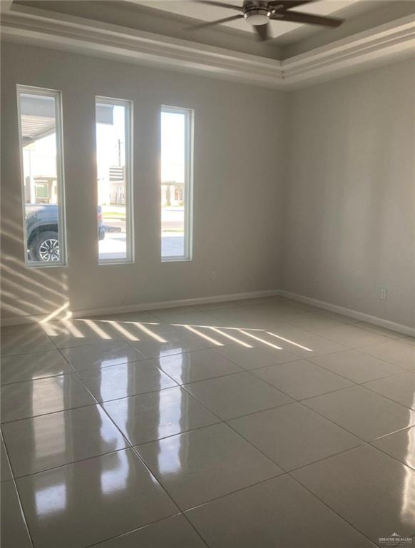 1411 South Flag Street, Unit 1 Pharr, TX 78577 - Photo 4 of 12 a view of a livingroom with a projector and a window
