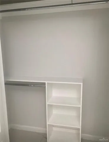 a view of an empty walk in closet