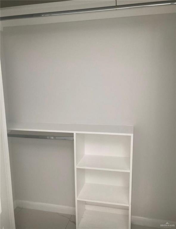 1411 South Flag Street, Unit 1 Pharr, TX 78577 - Photo 8 of 12 a view of an empty walk in closet