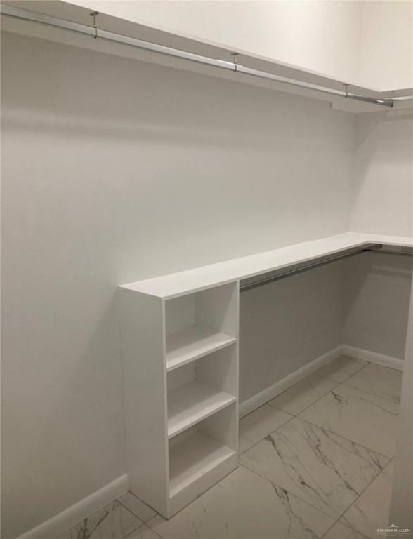 1411 South Flag Street, Unit 1 Pharr, TX 78577 - Photo 9 of 12 a view of an empty walk in closet