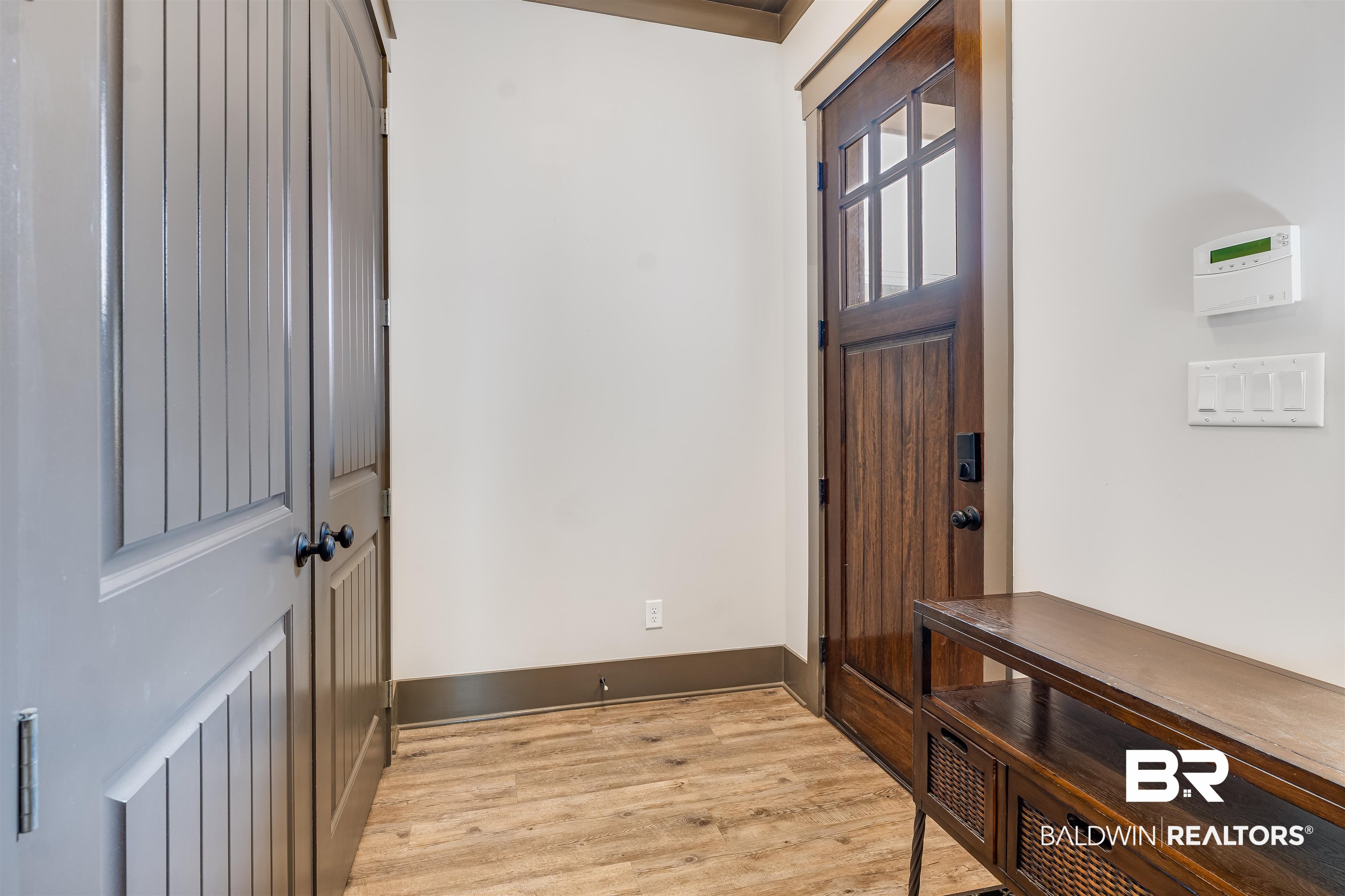 1119 Pink Poppy Lane Foley, AL 36535 - Photo 10 of 38 Side entrance foyer featuring light wood-style flooring and baseboards. Laundry room.