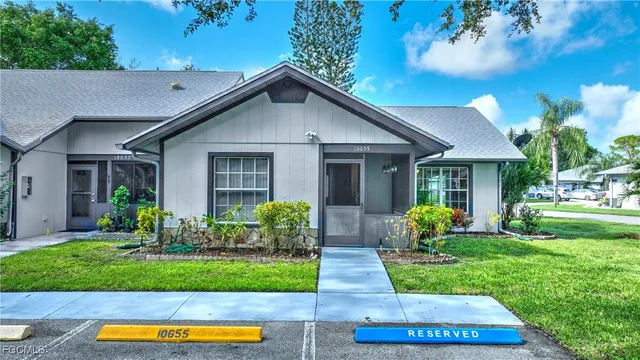 a front view of a house with a yard and porch