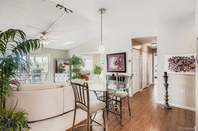a view of a dining room with furniture window and wooden floor