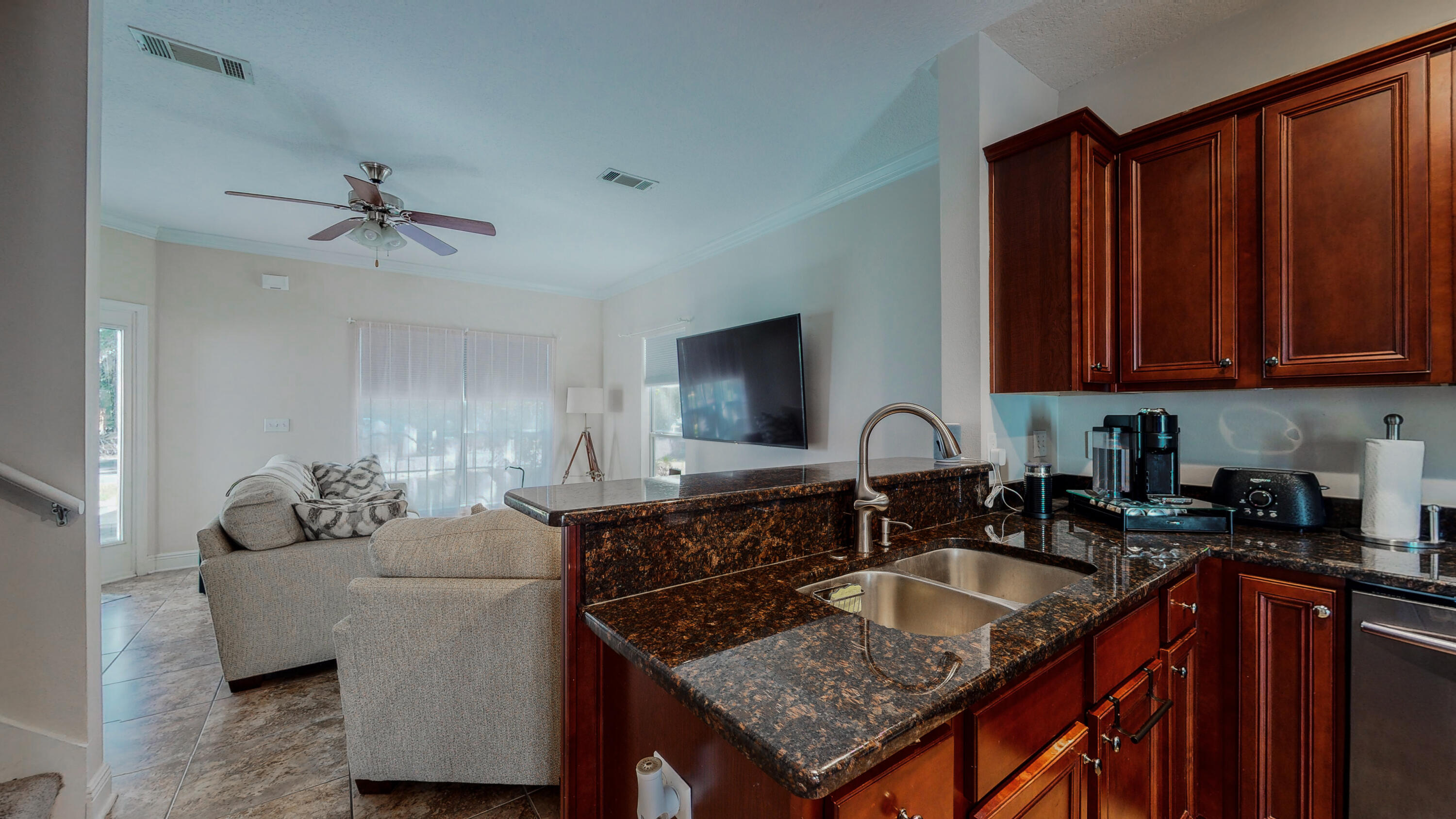 23 Beacon Point Drive Santa Rosa Beach, FL 32459 - Photo 12 of 33 a kitchen with granite countertop a sink a counter top space and cabinets