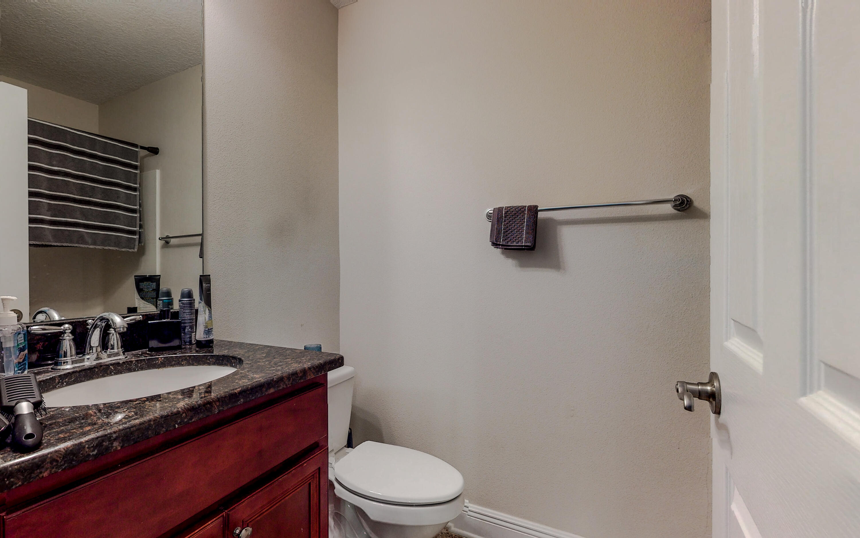 23 Beacon Point Drive Santa Rosa Beach, FL 32459 - Photo 14 of 33 a bathroom with a granite countertop sink toilet and a mirror