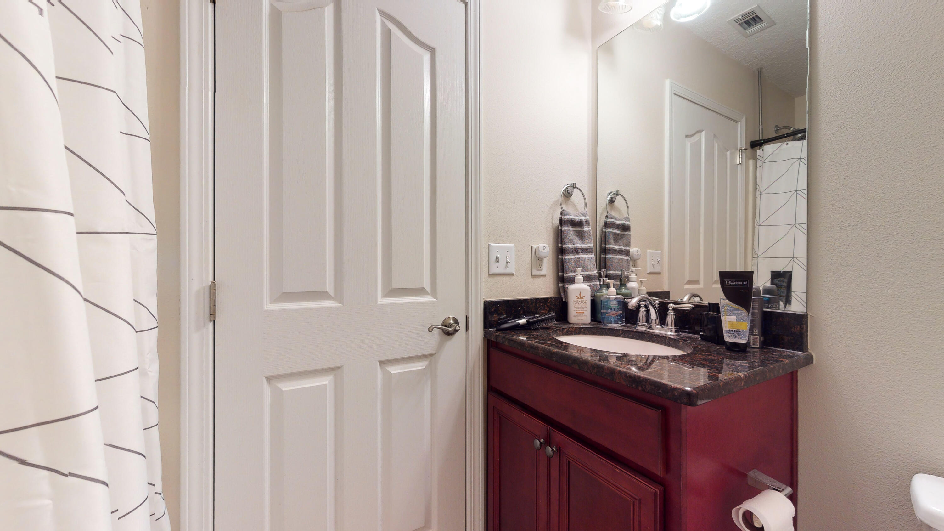 23 Beacon Point Drive Santa Rosa Beach, FL 32459 - Photo 15 of 33 a bathroom with a granite countertop sink and a mirror